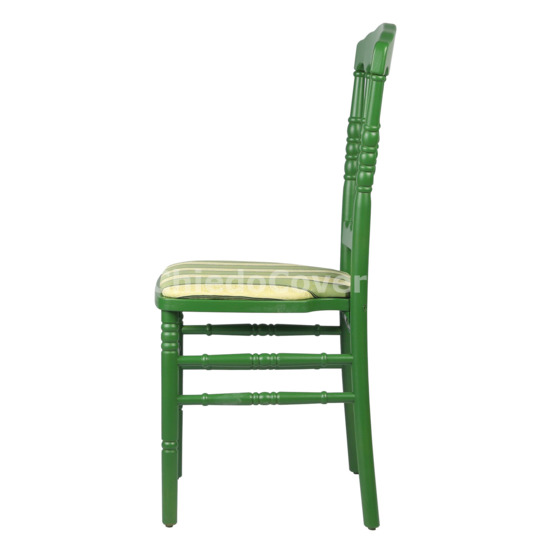 The Napoleon chair is green, with a cushion - photo 2