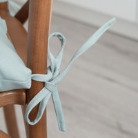 Product photo A pillow with ties on a chair, dusty mint from the ChiedoCover company.